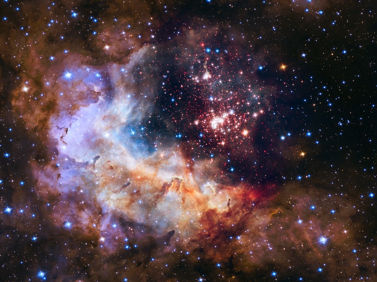 This NASA/ESA Hubble Space Telescope image of the cluster Westerlund 2 and its surroundings has been released to celebrate Hubble’s 25th year in orbit and a quarter of a century of new discoveries, stunning images and outstanding science. The image’s central region, containing the star cluster, blends visible-light data taken by the Advanced Camera for Surveys and near-infrared exposures taken by the Wide Field Camera 3. The surrounding region is composed of visible-light observations taken by the Advanced Camera for Surveys.